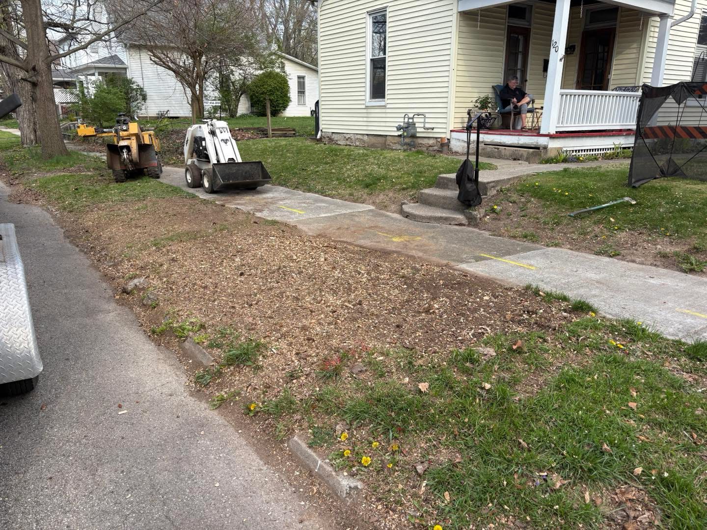 Stump grinding work in progress on a residential property